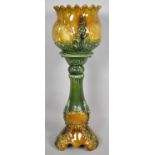 A Green and Treacle Drip Glazed Jardiniere on Stand, 84cms High