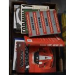 A Collection of Various Books on a Motor Sport Topic