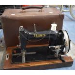 A Triumph Portable Manual Sewing Machine, 58cms Wide