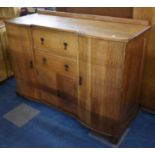 An Early/Mid 20th Century Oak Sideboard, with Central Two Drawer Store and Cupboard Base Flanked