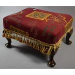 An Upholstered Footstool on Short Cabriole Supports, 41cms Wide x 24cms High