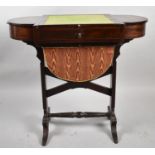 A 19th Century Work Table with Central Well Flanked by Two Hinged Compartments, Turned Stretcher,