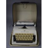 A Vintage Cased Portable Adler Typewriter