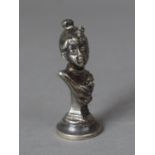 A Small White Metal Seal in the form of a Maiden, Daisy, 8cms High