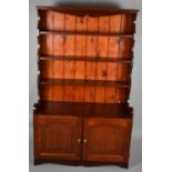 An Oak Reproduction Dresser with Cupboard Base and Four Shelved Section of Small Proportions,