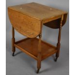 An Oak Mid 20th Century Drop leaf Trolley with Stretcher Shelf, 59cms Wide