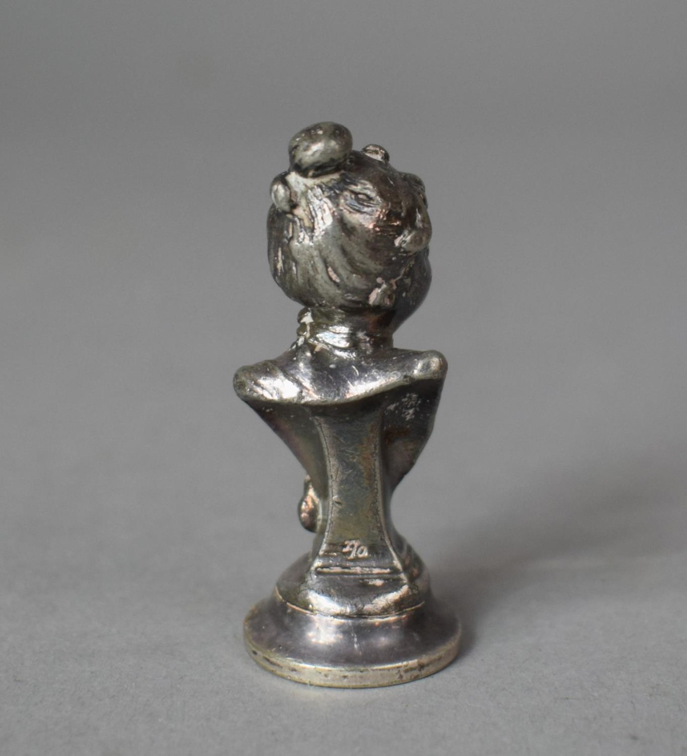 A Small White Metal Seal in the form of a Maiden, Daisy, 8cms High - Image 2 of 2