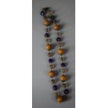 A Blue Foil Glass and Wooden Bead Necklace