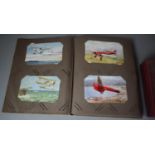 Two Postcard Albums Containing Early/ Mid 20th Century Examples to include Planes, Trains, Boats,