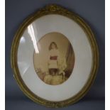 A Late 19th/Early 20th Century Gilt Framed Sepia Photograph of young Girl, The Oval Frame with