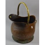 A Late 19th Century Copper and Brass Handled Helmet Shaped Coal Scuttle, 26cms High