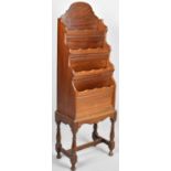 A Mahogany Four Tiered Waterfall Magazine Stand, 109cm high