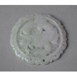 A White Jadeite Medallion Depicting Dragon with Flaming Pearl, 5cm Diameter