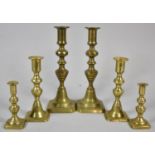 Three Sets of 19th Century Brass Candlesticks with Pushers, the Tallest 22.5cm high