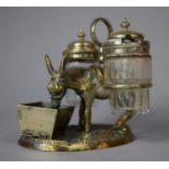 A Silver Plated Novelty Cruet in the Form of Donkey with Saddle Bags at Trough, 10cm high