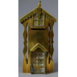 A Late 19th Century Brass Money Bank in the Form of a House, 17cm high