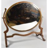 An Edwardian Mahogany Framed Oval Swing Dressing Table Mirror, 57cm wide