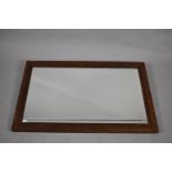 An Edwardian Oak Framed Rectangular Wall Mirror with Bevelled Glass, 76cm wide