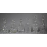 A Collection of Six Various Cut Glass Decanters