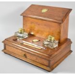 An Edwardian Mahogany Desk Top Stationery Box with Base Drawer, Two Inkwells and Pen Tray, Hinged