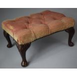 A Buttoned Upholstered Rectangular Stool on Short Cabriole Supports, 42cm long