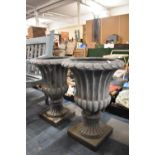 A Pair of Reconstituted Campana Style Urns, Each 66cm high