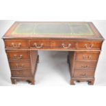 A Modern Mahogany Kneehole Writing Desk with Tooled Leather Top, 200cm x 120cm wide