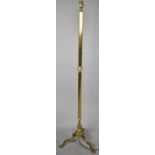 A Mid 20th Century Brass Ribbed Column Tripod Standard Lamp
