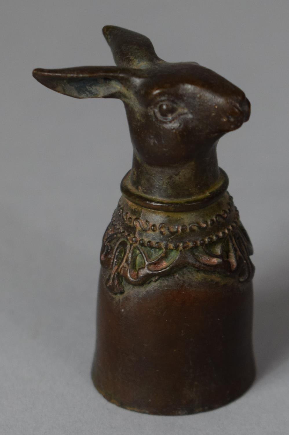 A Bronze Candle Snuff with Rabbit Head Finial, 6cm high