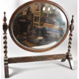 An Edwardian Oak Barley Twist Toilet Mirror with Oval Glass and Carved Rail, 64cm wide