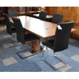A Modern Extending Rectangular Dining Table Together with Six Modern Hide Effect Dining Chairs on
