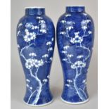 A Pair of Chinese Blue and White Prunus Pattern Vases of Baluster Form, Bearing Kangxi Double Circle