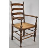 An Edwardian Rush Seated Ladder Back Armchair with Plaque Inscribed, In Remembrance of May 28th 1918
