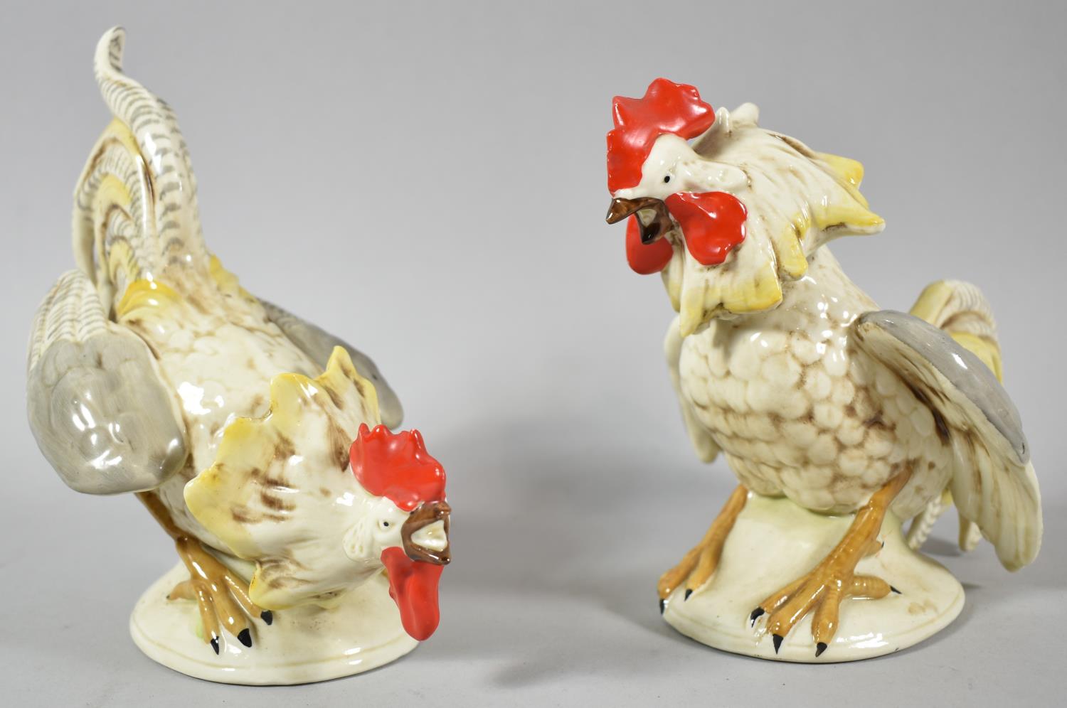 A Pair of Late 19th Century German Ceramic Studies of Fighting Cocks, 18cm high