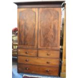 A 19th Century Mahogany Linen Press, the Base with Two Short and Two Long Drawers, Panelled Doors to