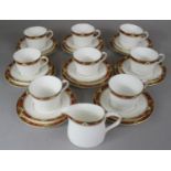 A Royal Crown Derby Cloisonne Tea Set Comprising Eight Trios and a Cream Jug