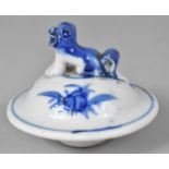 A 19th Century Chinese Vase Lid with Under Glazed Decoration and Foo Dog Finial, 7cm high