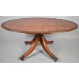 An Oval Elm Cross Banded Coffee Table, 119cm long