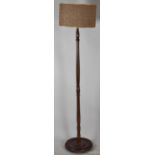 A Mid 20th Century Turned Mahogany Standard Lamp with Shade