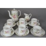 A Floral Patterned Part Coffee Service Comprising Five Coffee Cans, Six Saucers, Coffee Pot, Cream