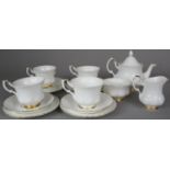 A Royal Albert Val D'or Part Teaset comprising Four Trios, Teapot, Cream and Sugar Bowl