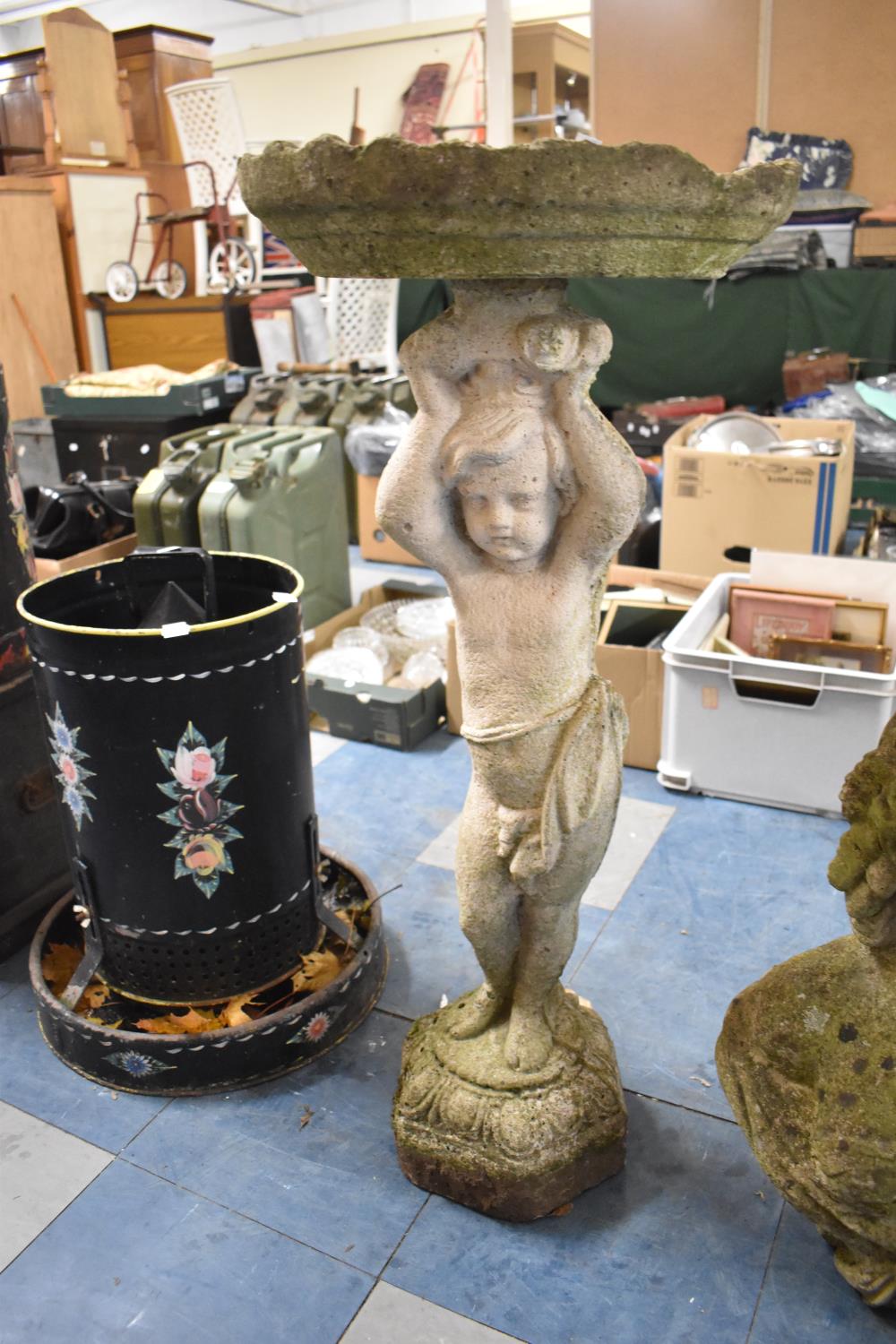 A Reconstituted Stone Figural Bird Bath in the Form of Cherub Supporting Lily Pad, 88cm high and