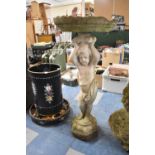 A Reconstituted Stone Figural Bird Bath in the Form of Cherub Supporting Lily Pad, 88cm high and