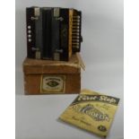 A Mid 20th Century Cardboard Cased Melodion or Accordion, The Cornetta, Complete with Teach Yourself