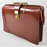 A Leather Briefcase, 43cm wide with Keys