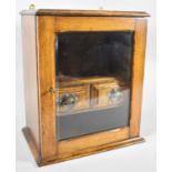 An Edwardian Glazed Oak Smokers Cabinet with Fitted Interior Having Recess for Tobacco Bowl and