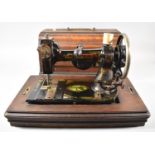 A 19th Century American "White Peerless" Sewing Machine in Mahogany Case