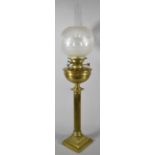 A Late 19th Century Brass Oil Lamp Supported on Reeded Column Set on Square Stepped Base, Acid