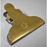 A Heavy Brass Document Clip, 10.5cm wide