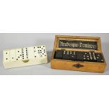 A Bakelite Cased Set of Bakelite 6 spot Dominoes and a Wooden Box Containing Six Spot Dominoes